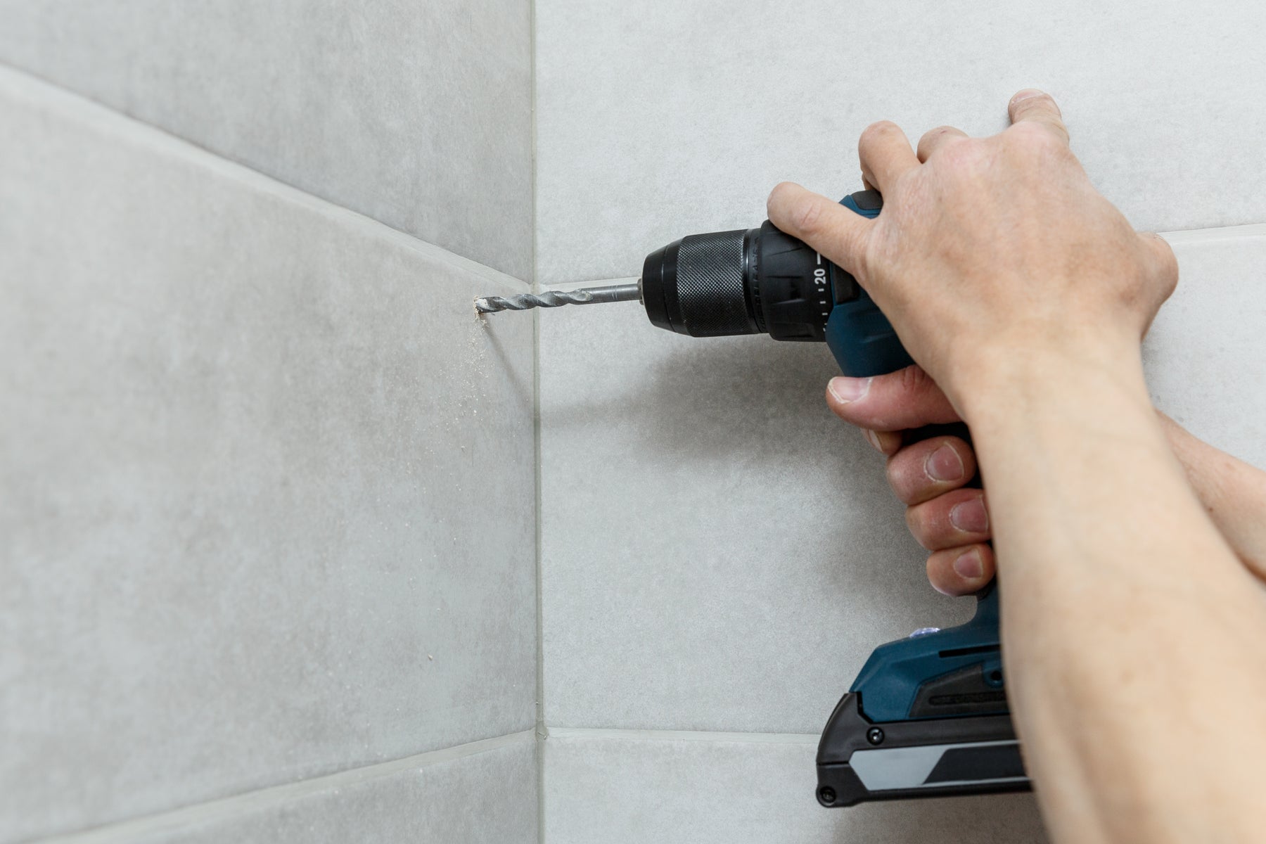 How do I drill through ceramic and porcelain tile?